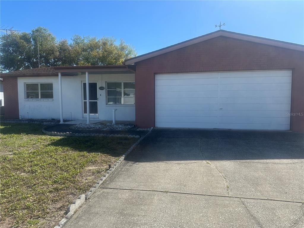 9308 Wolcott Lane Port Richey, FL 34668 - Photo 1 of 1 a backyard of a house