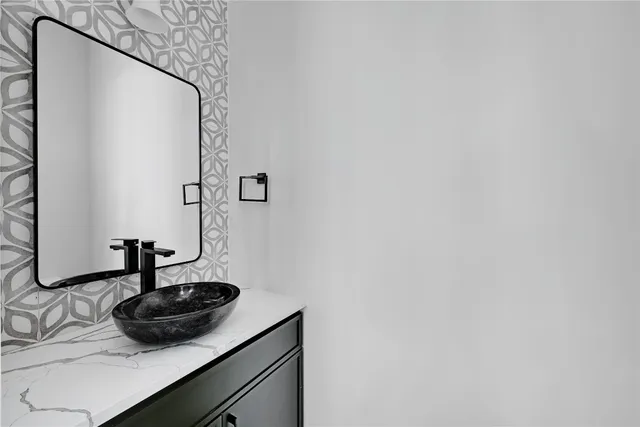 a bathroom with a sink and a mirror