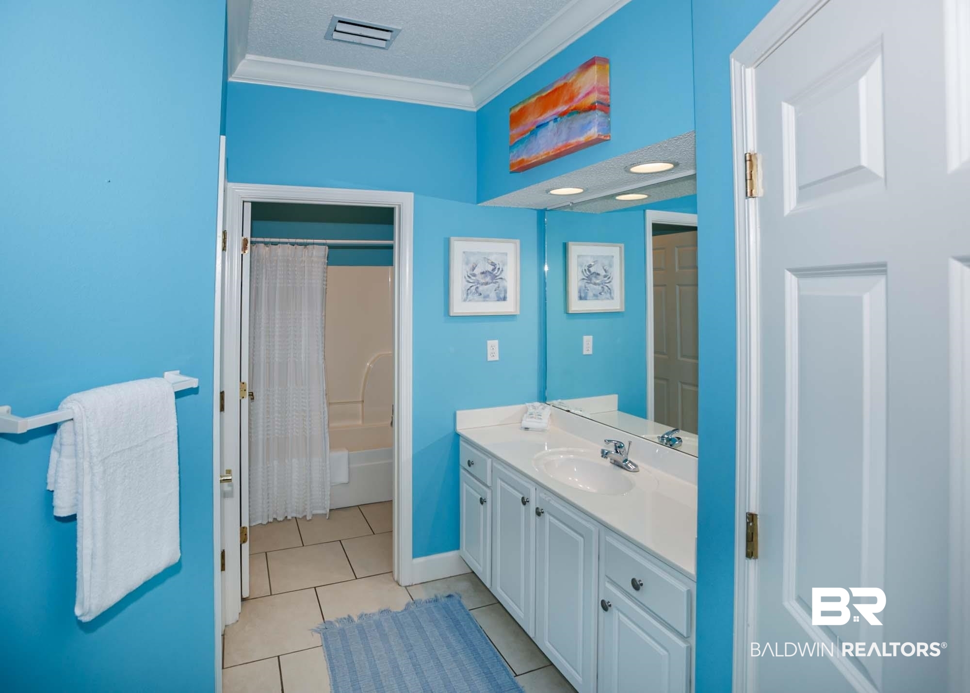 28910 Perdido Beach Boulevard, Unit 4B Orange Beach, AL 36561 - Photo 37 of 48 Full bathroom with a textured ceiling, visible vents, crown molding, tile patterned floors, and vanity