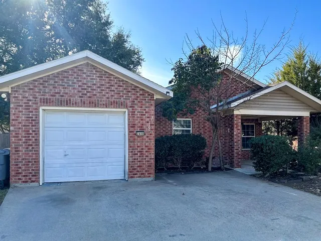 front view of a house with a garden