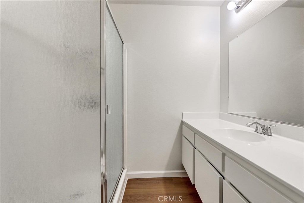 3000 Associated Road, Unit 60 Fullerton, CA 92835 - Photo 17 of 51 a bathroom with a sink and mirror