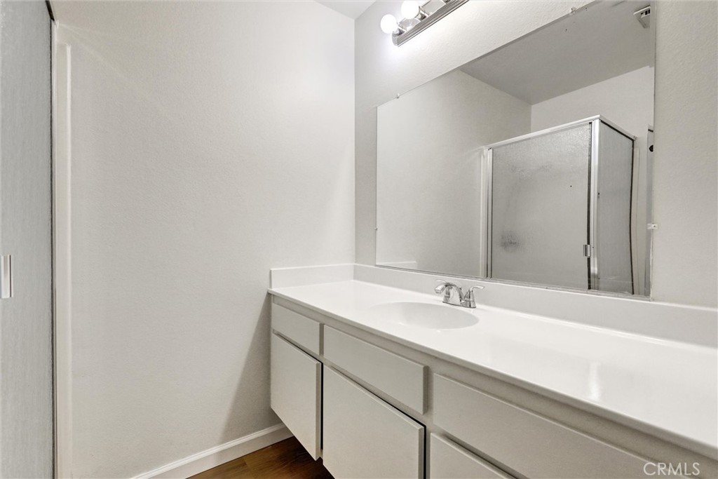 3000 Associated Road, Unit 60 Fullerton, CA 92835 - Photo 21 of 56 a bathroom with a sink and a mirror