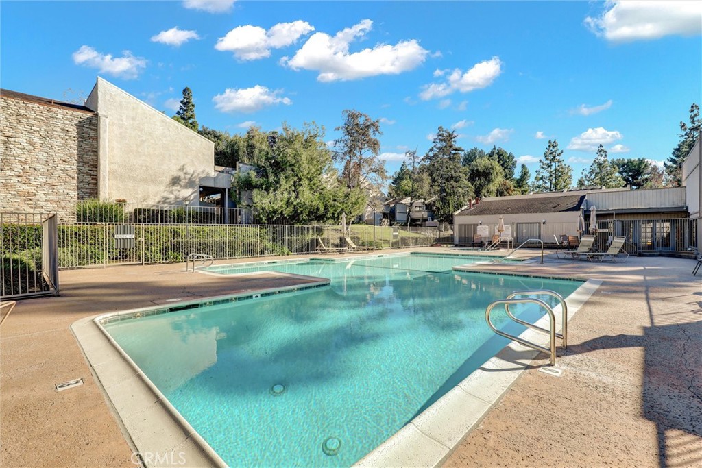 3000 Associated Road, Unit 60 Fullerton, CA 92835 - Photo 33 of 56 a view of a swimming pool with a patio