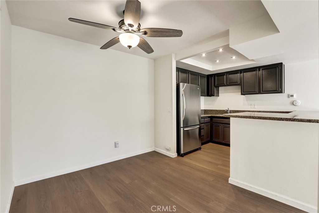 3000 Associated Road, Unit 60 Fullerton, CA 92835 - Photo 10 of 51 a kitchen with stainless steel appliances a stove a microwave and a refrigerator