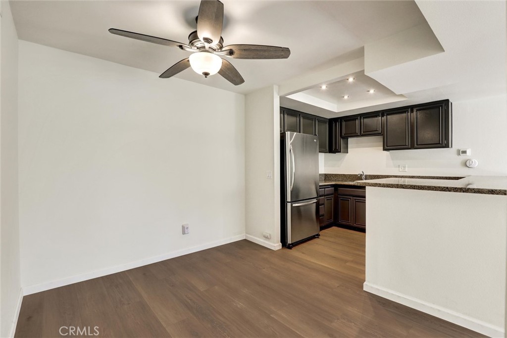 3000 Associated Road, Unit 60 Fullerton, CA 92835 - Photo 10 of 56 a kitchen with stainless steel appliances a stove a microwave and a refrigerator