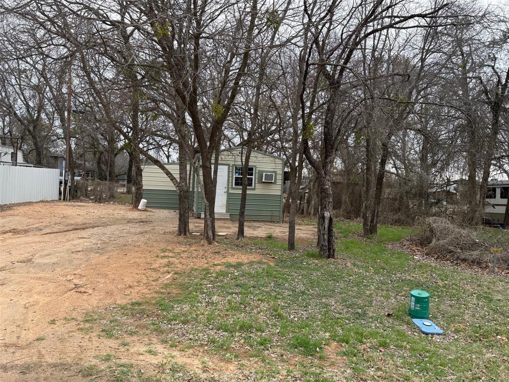 Tbd Tbd Tbd Port Comanche, TX 76442 - Photo 1 of 28 a house with trees in front of it