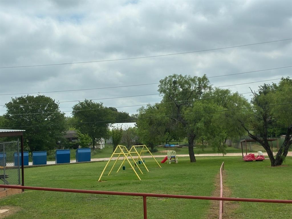 Tbd Tbd Tbd Port Comanche, TX 76442 - Photo 27 of 28 a front view of a yard with yellow lighting