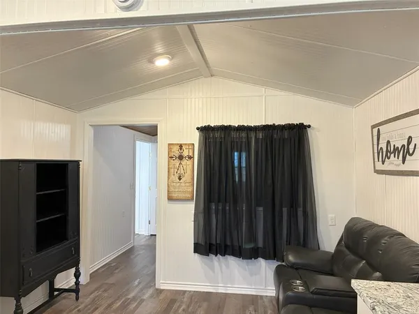 a living room with a furniture and a window