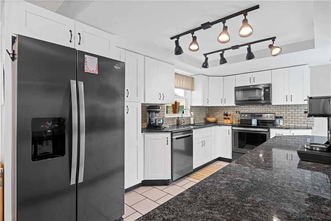 50 Kohls Road Northampton, PA 18067 - Photo 8 of 54 Culinary delights await in this bright kitchen with a spacious granite island, ideal for casual dining or entertaining.