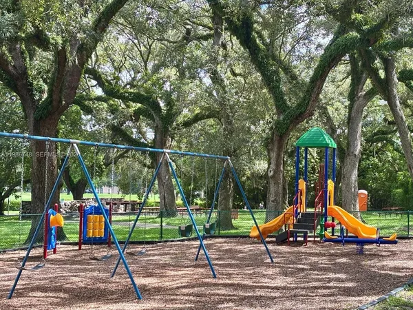 a view of park with a slide