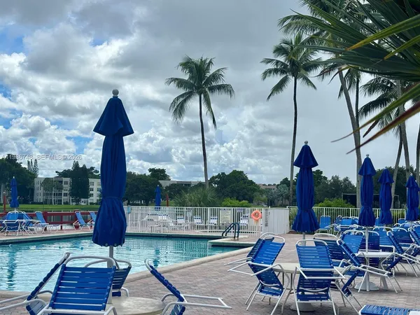 a view of a patio with swimming pool