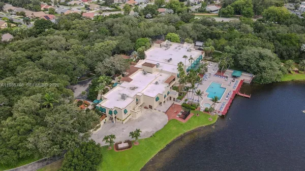 an aerial view of a house with a yard
