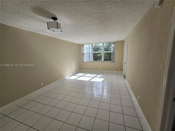 a view of an empty room and window