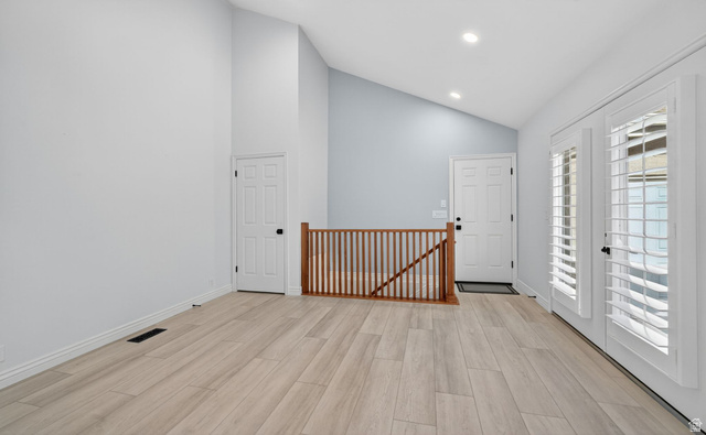 6969 South 855 East Midvale, UT 84047 - Photo 24 of 55 Room featuring wood-finish flooring, vaulted ceilings, and recessed lighting