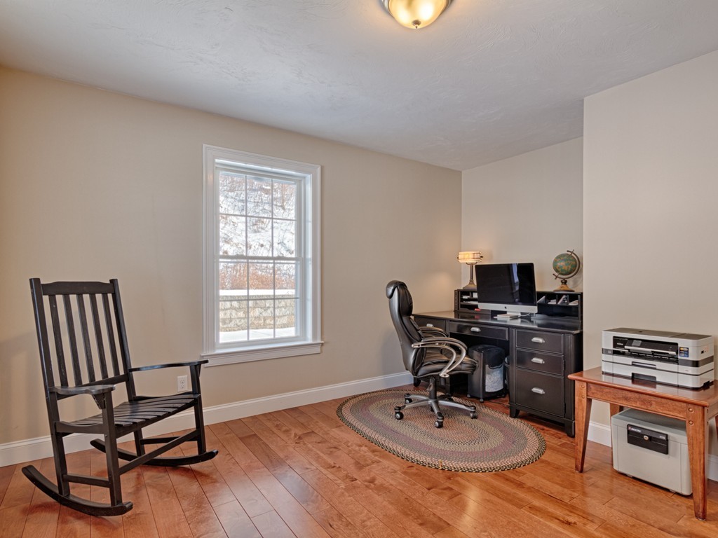 31 Harriman Road Merrimac, MA 01860 - Photo 9 of 30 a work room with furniture and wooden floor