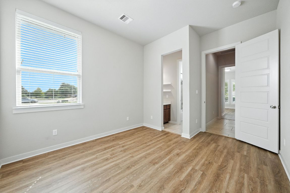 437 Pienza Drive Georgetown, TX 78628 - Photo 11 of 32 Second bedroom with jack and jill bath