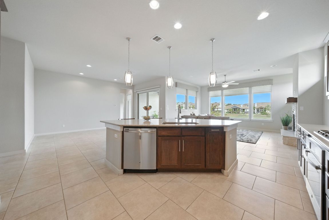 437 Pienza Drive Georgetown, TX 78628 - Photo 13 of 32 Living room, large windows with view of the lake