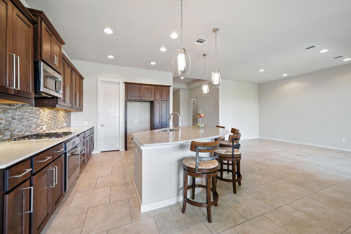 437 Pienza Drive Georgetown, TX 78628 - Photo 14 of 32 Kitchen with large island