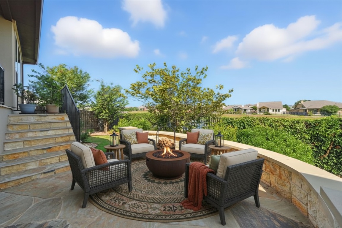 437 Pienza Drive Georgetown, TX 78628 - Photo 29 of 32 a view of a patio with couches table and chairs and potted plants