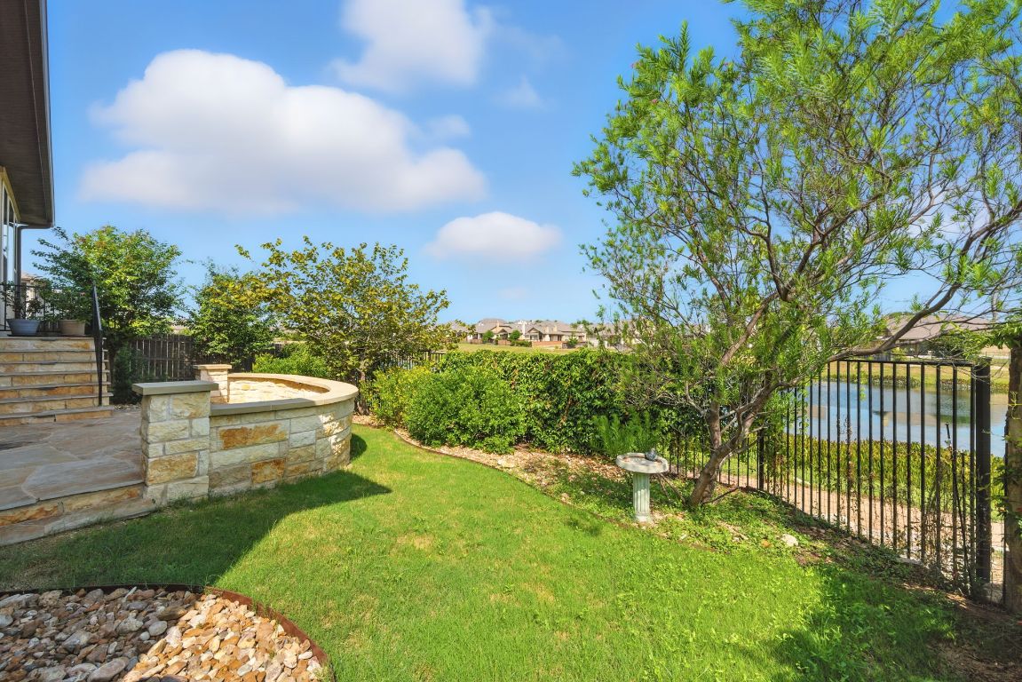 437 Pienza Drive Georgetown, TX 78628 - Photo 30 of 32 a view of a backyard with fountain