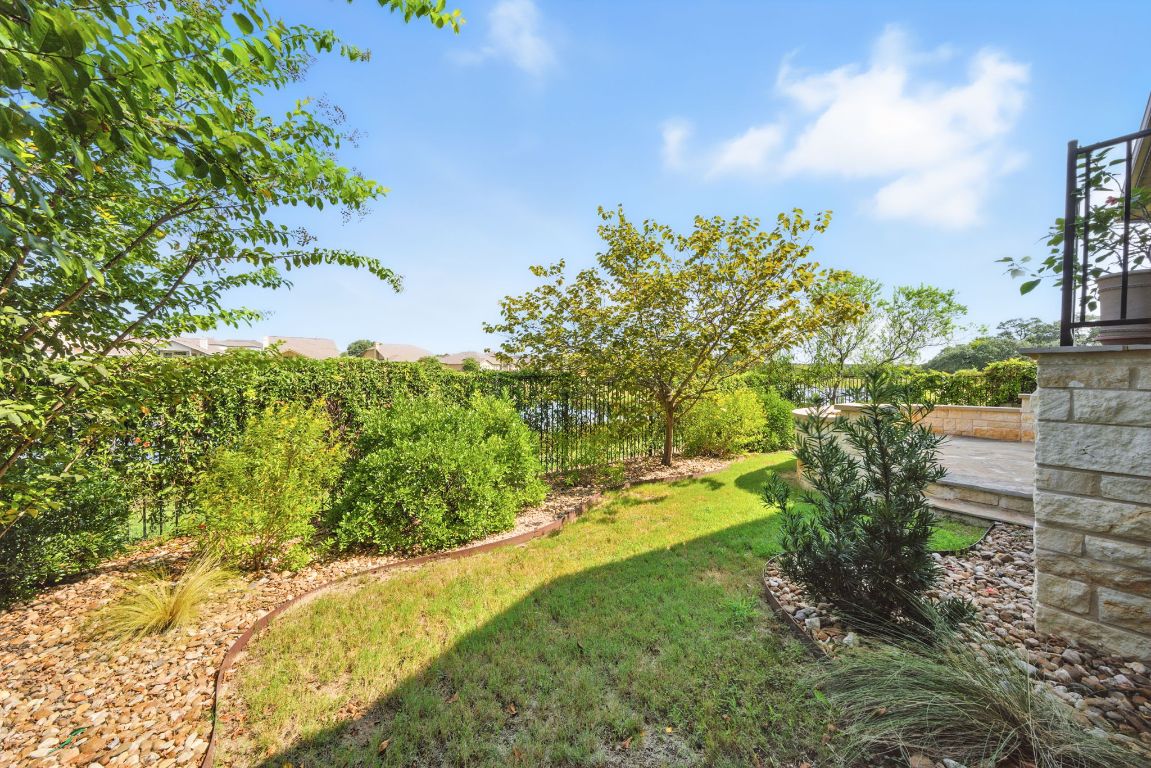 437 Pienza Drive Georgetown, TX 78628 - Photo 31 of 32 a view of a yard with an trees