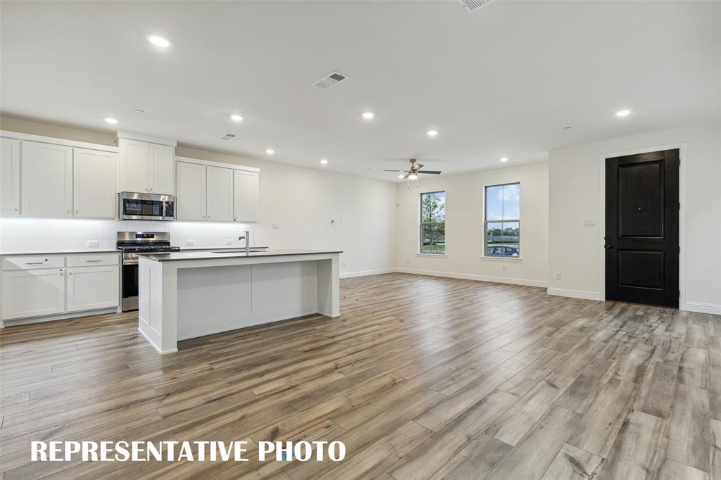 1011 Magdalena Way Midlothian, TX 76065 - Photo 5 of 16 Our Hansen plan features an open concept design that is perfect for entertaining family & friends! REPRESENTATIVE PHOTO