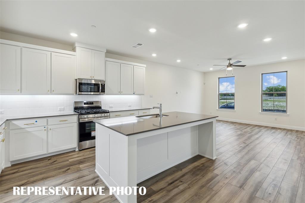 1011 Magdalena Way Midlothian, TX 76065 - Photo 9 of 16 The spacious island offers the perfect place for friends and family to gather round! REPRESENTATIVE PHOTO