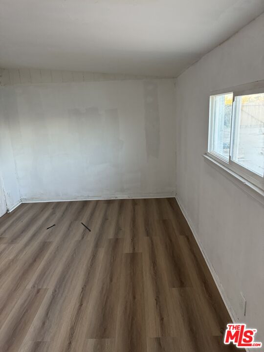 4908 Fort Tejon Road Palmdale, CA 93552 - Photo 20 of 21 a view of wooden floor and window in a room