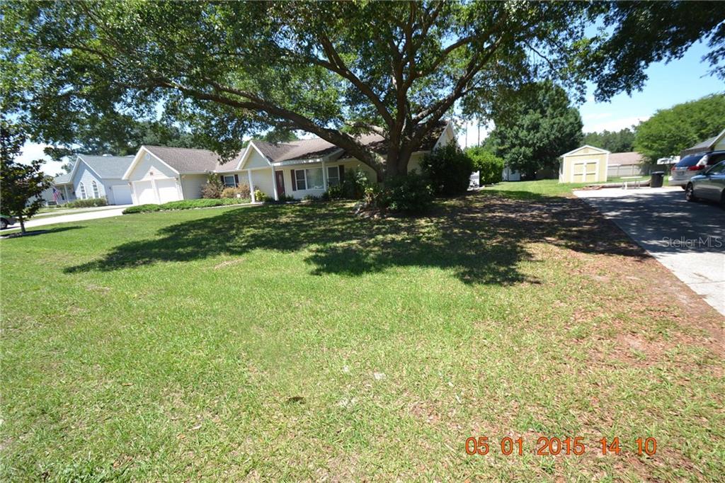 29329 Rhodin Place Wesley Chapel, FL 33545 - Photo 1 of 1 a front view of a house with a yard