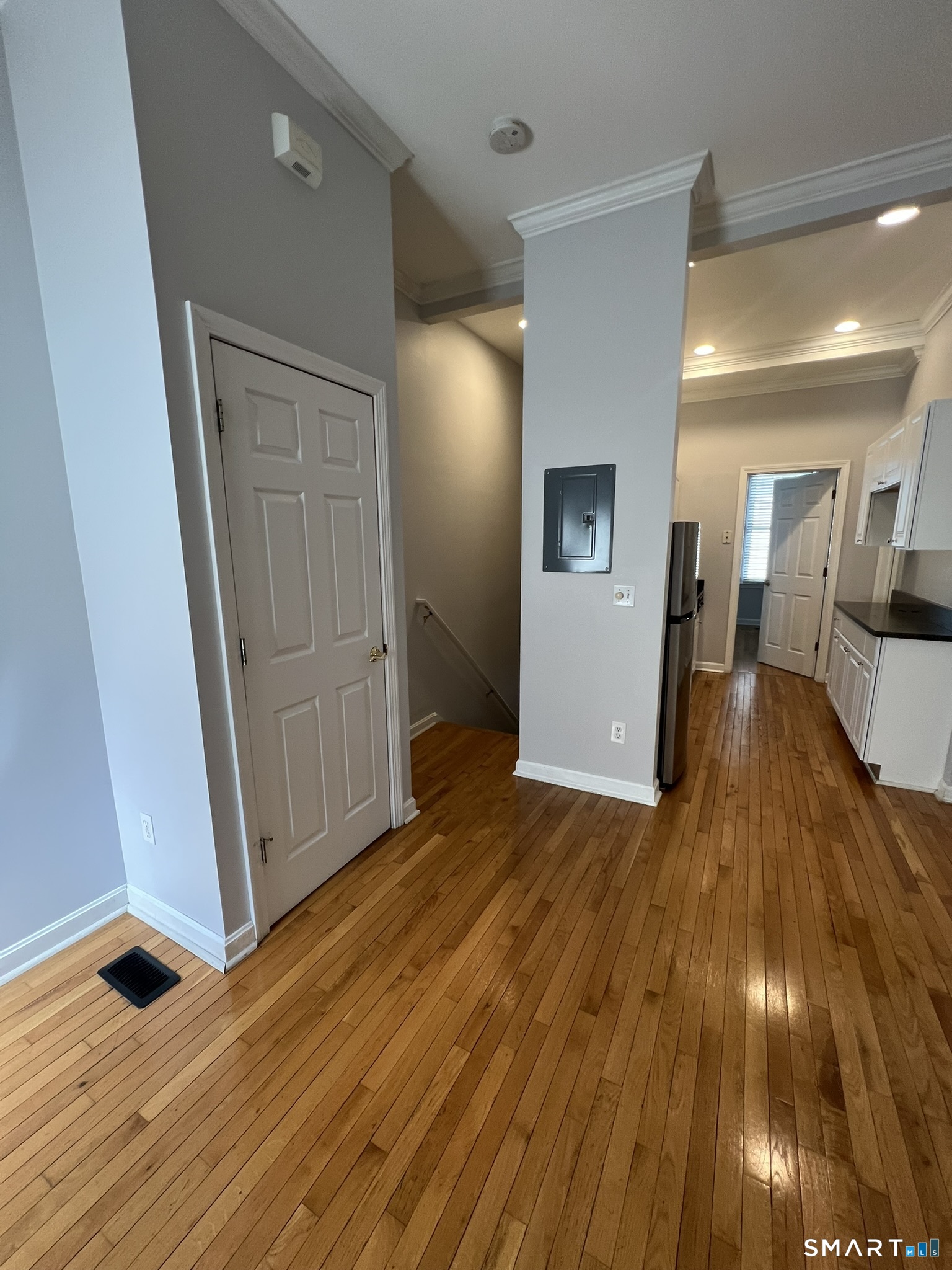 49 Glenbrook Road, Unit 103 Stamford, CT 06902 - Photo 32 of 47 Coat closet and stairs to lowerlevel