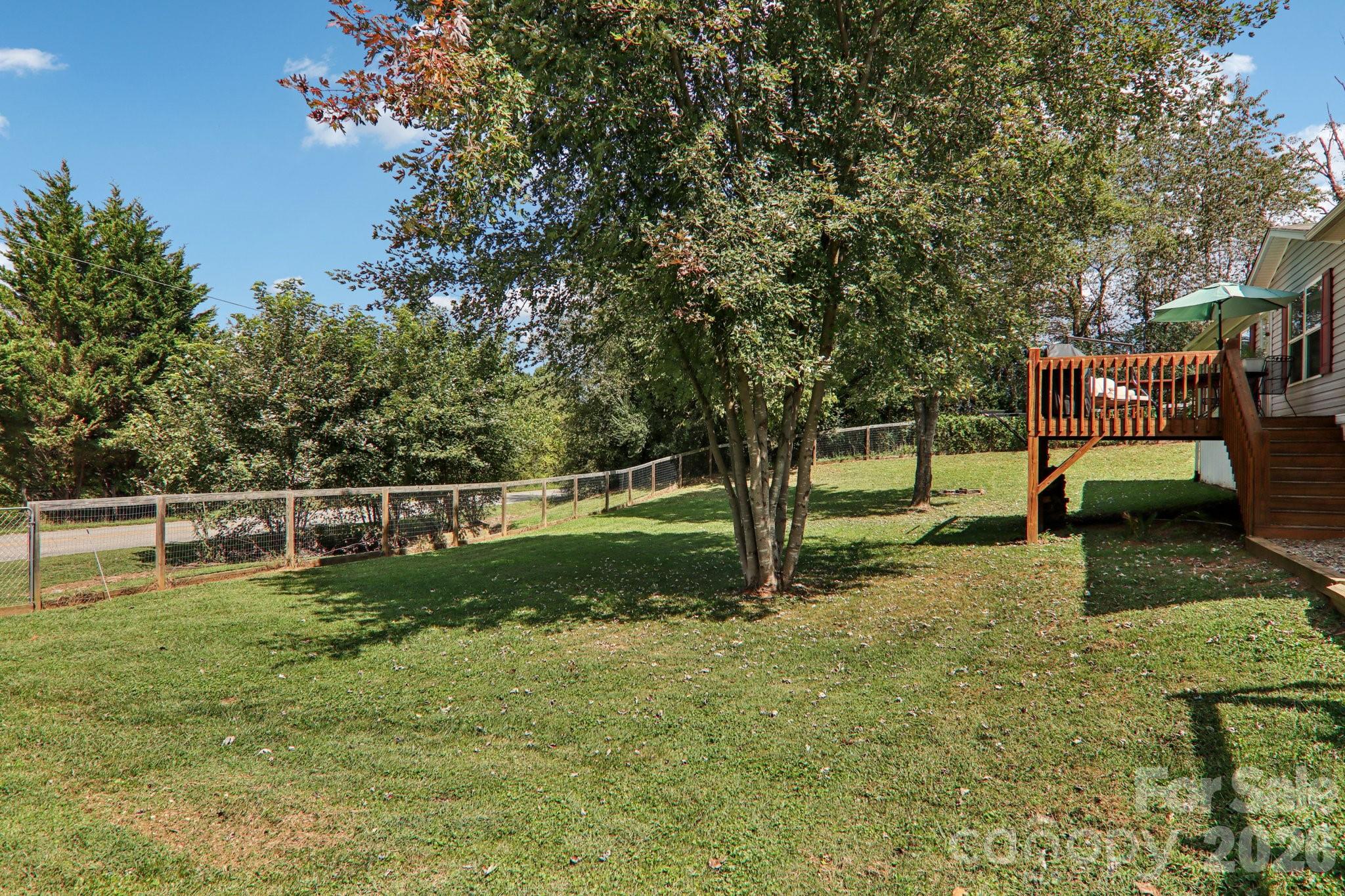 4 Sweet Birch Drive Alexander, NC 28701 - Photo 11 of 48 a view of a garden with trees