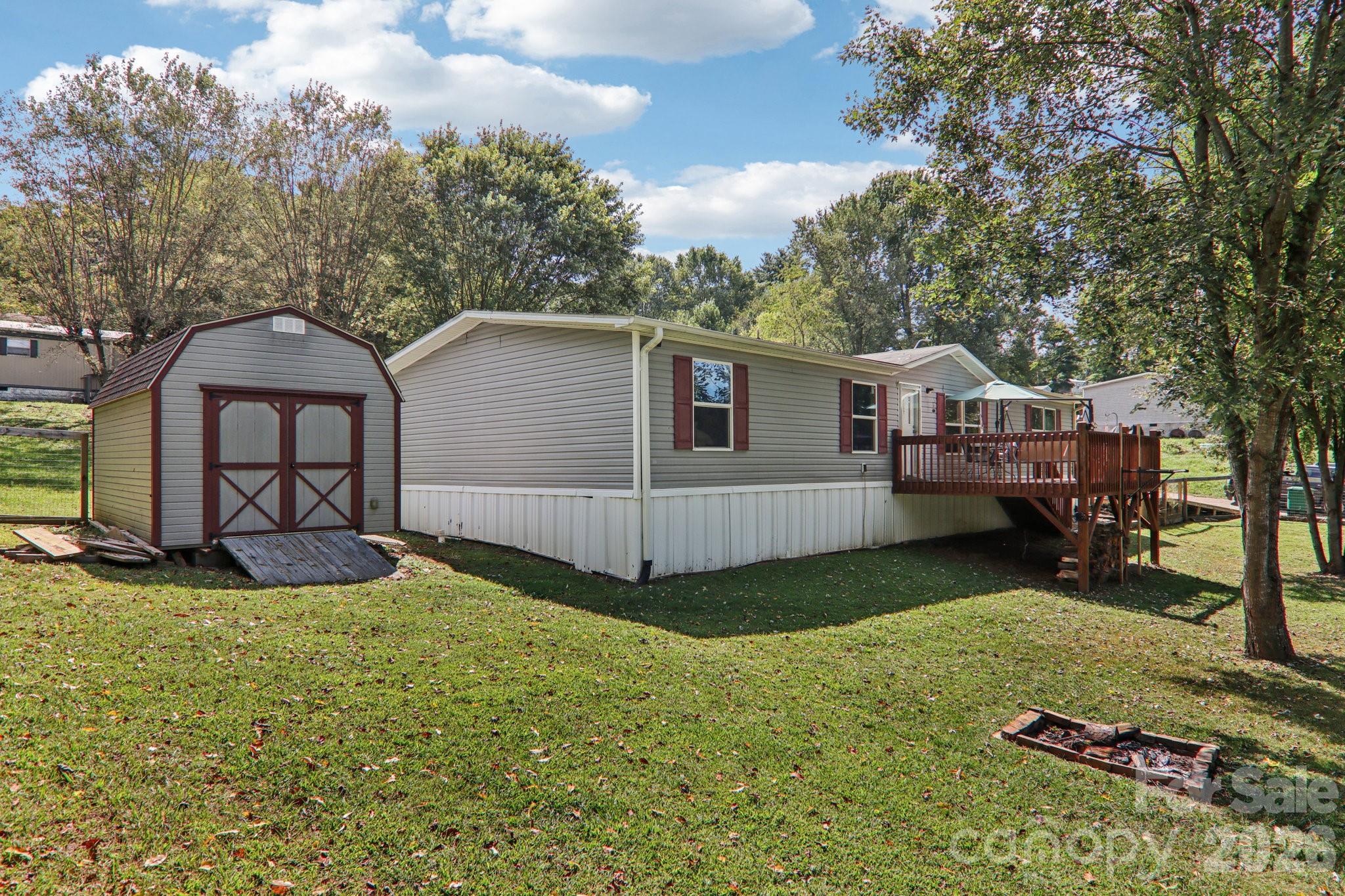 4 Sweet Birch Drive Alexander, NC 28701 - Photo 12 of 48 a view of a house with backyard and sitting area