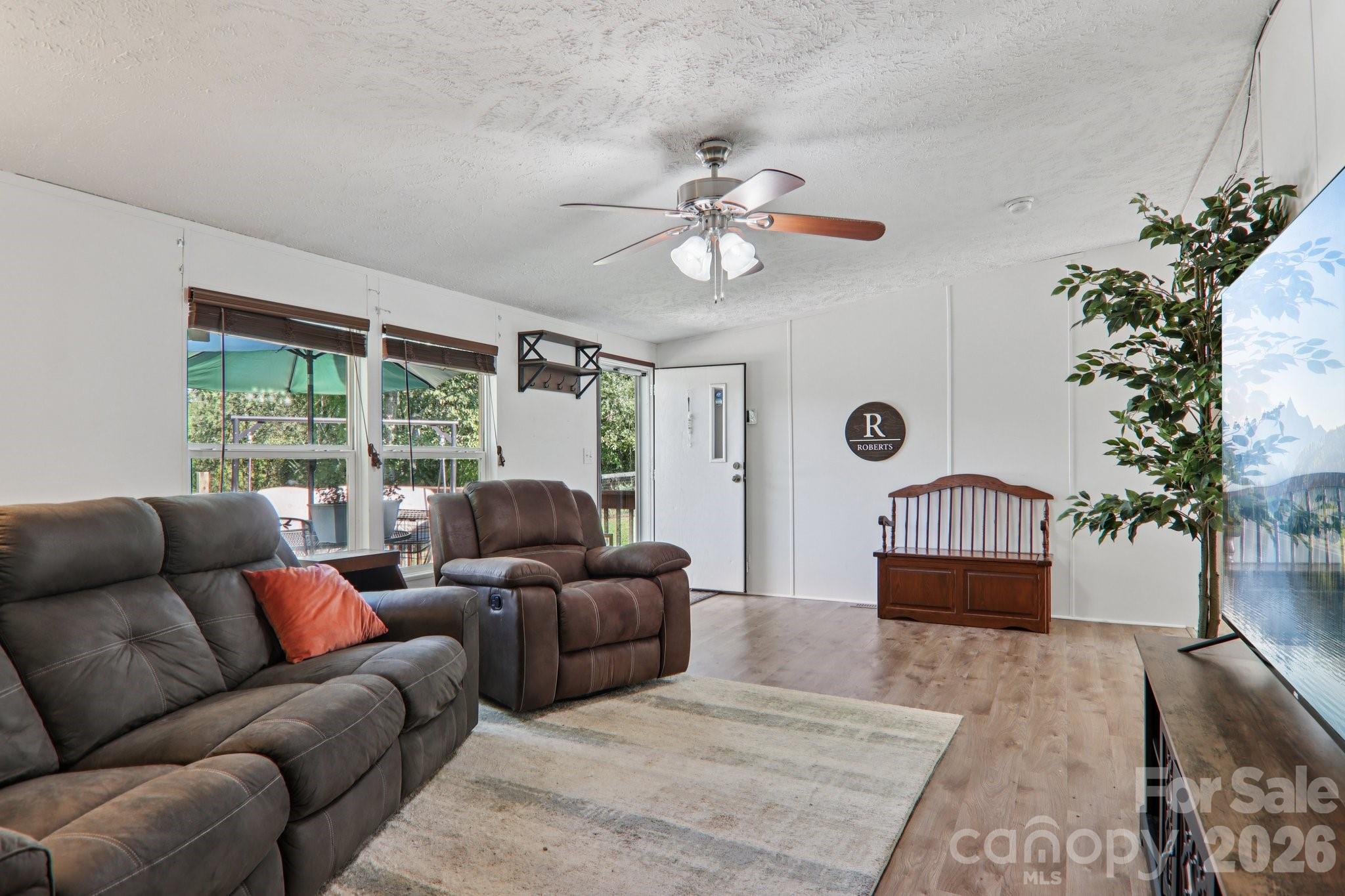 4 Sweet Birch Drive Alexander, NC 28701 - Photo 13 of 48 a living room with furniture potted plant and a window