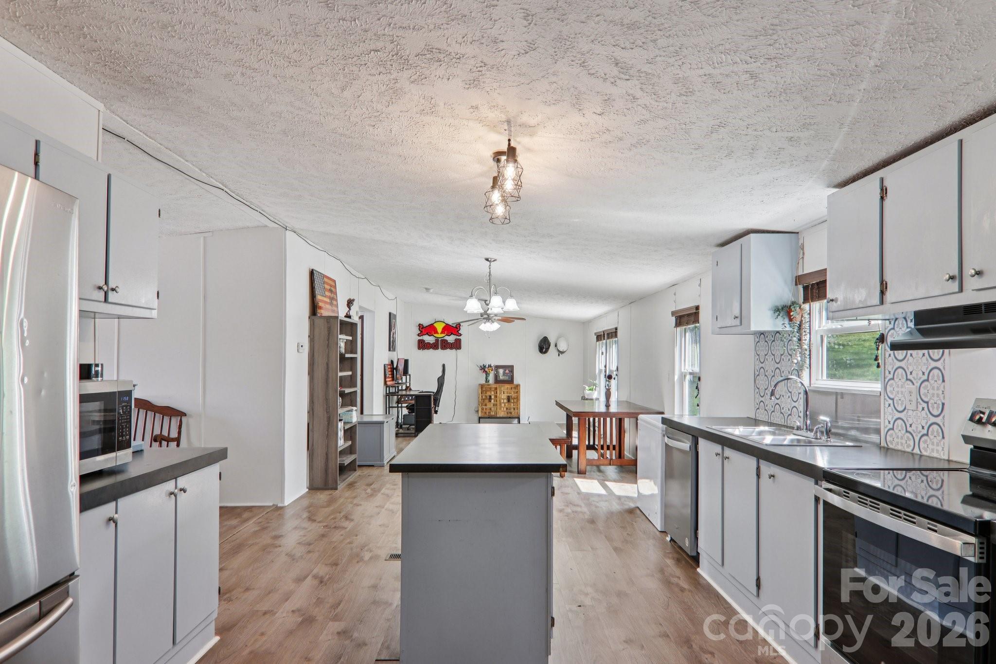 4 Sweet Birch Drive Alexander, NC 28701 - Photo 26 of 48 a large kitchen with granite countertop lots of counter top space