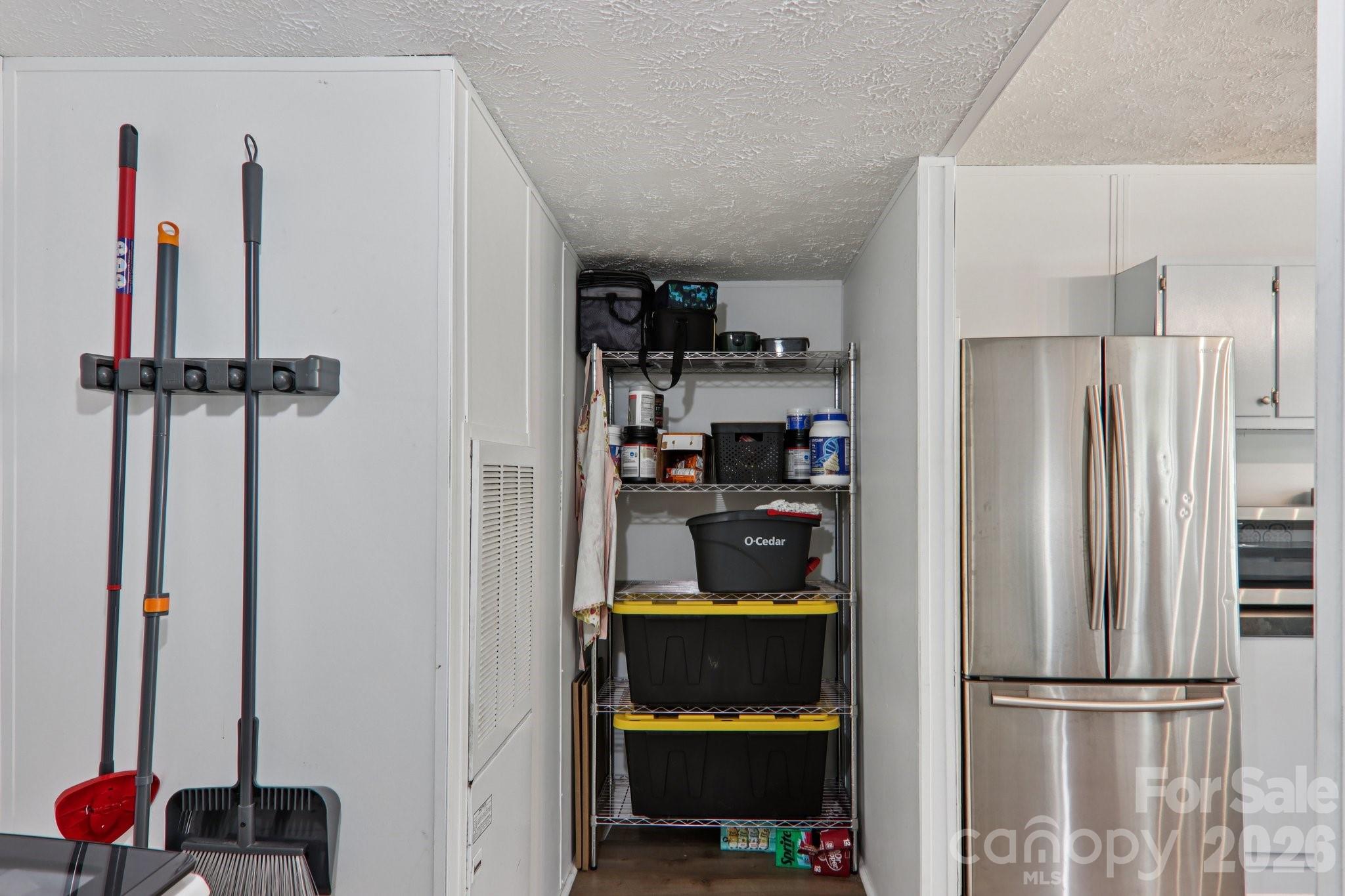 4 Sweet Birch Drive Alexander, NC 28701 - Photo 28 of 48 a kitchen with a refrigerator and cabinets