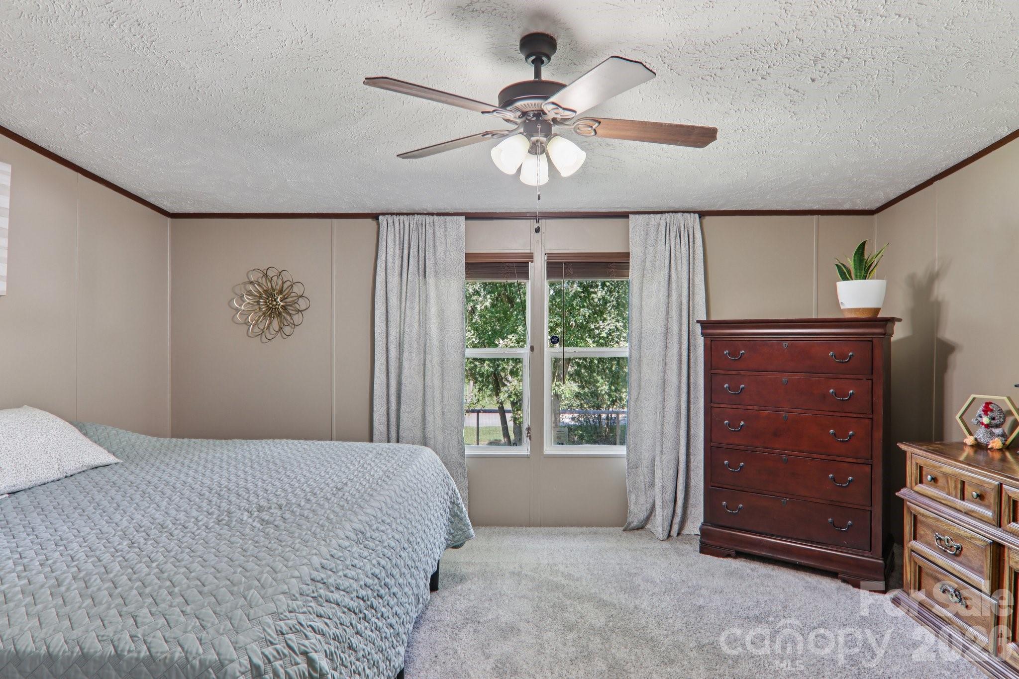 4 Sweet Birch Drive Alexander, NC 28701 - Photo 32 of 48 a bedroom with a bed and a window