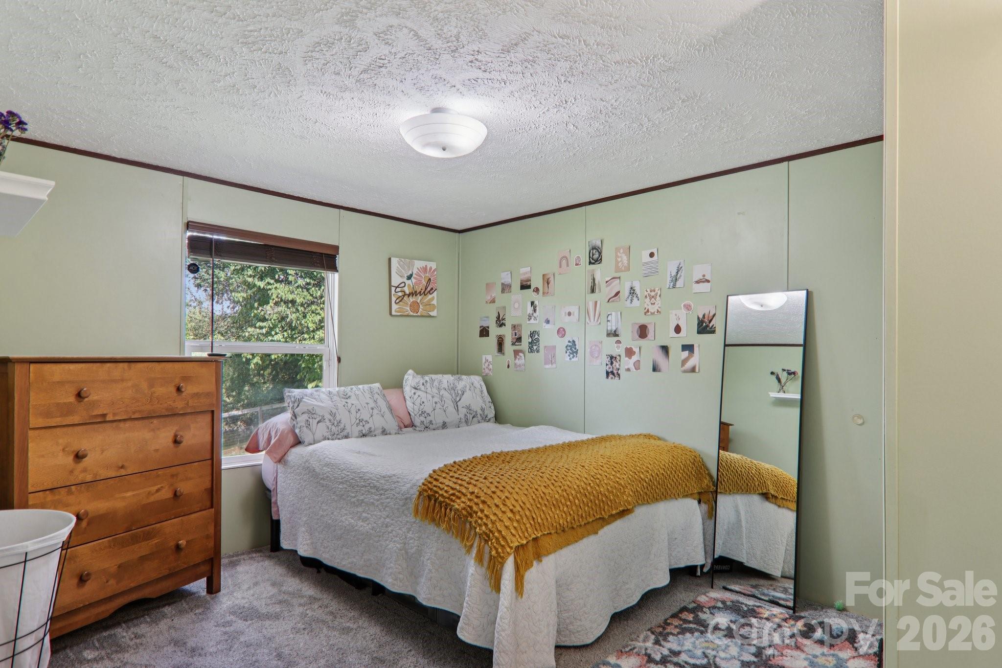 4 Sweet Birch Drive Alexander, NC 28701 - Photo 35 of 48 a bedroom with a bed and a window