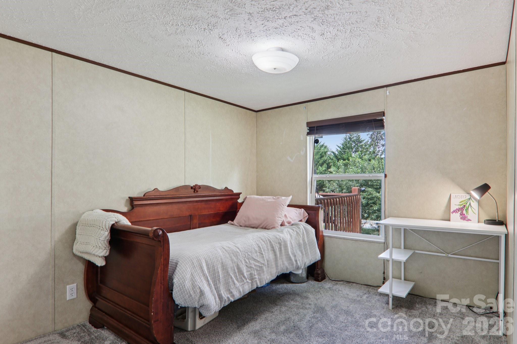 4 Sweet Birch Drive Alexander, NC 28701 - Photo 39 of 48 a bedroom with a bed and window