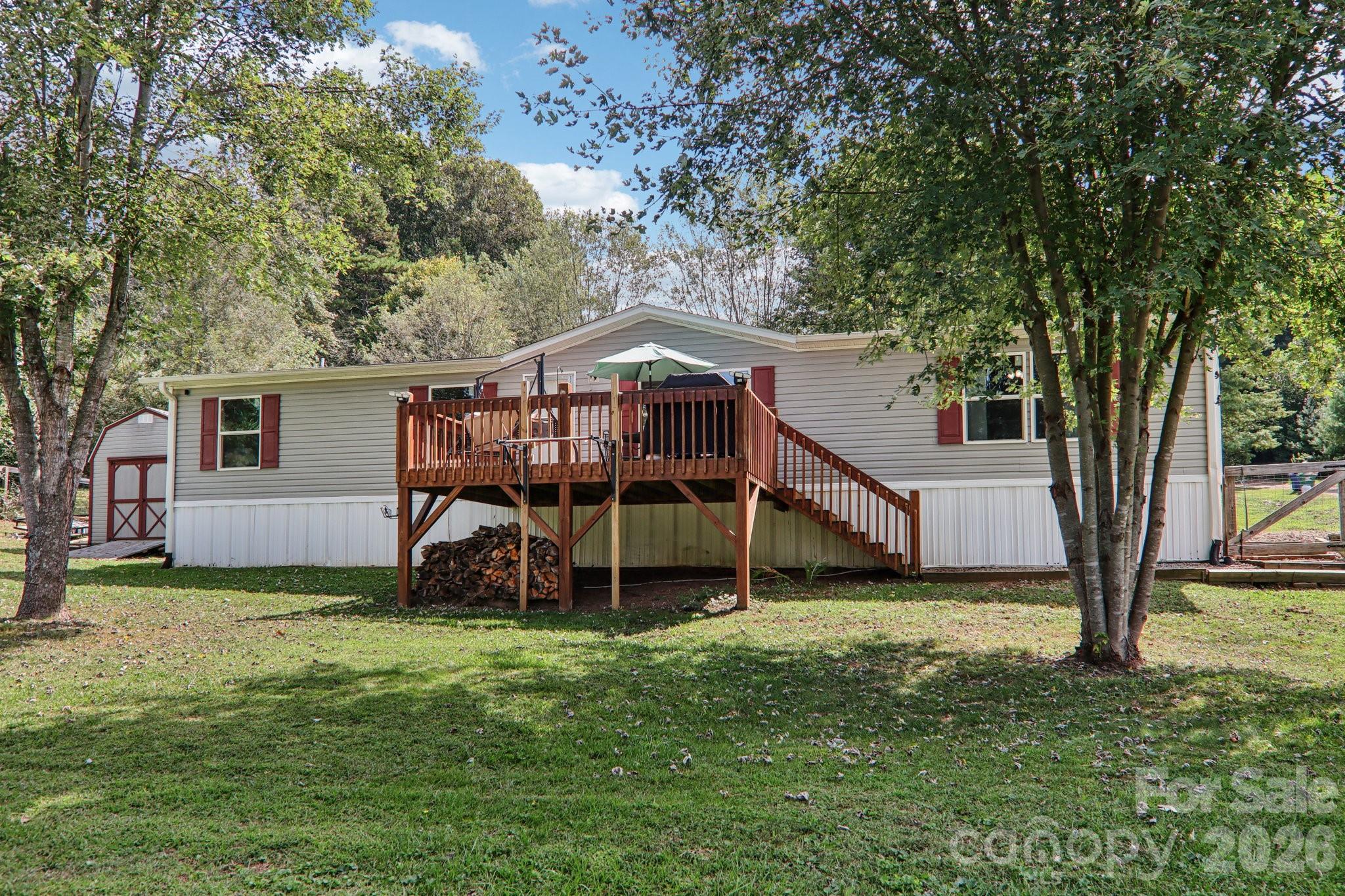 4 Sweet Birch Drive Alexander, NC 28701 - Photo 4 of 48 a view of a house with a yard and sitting area