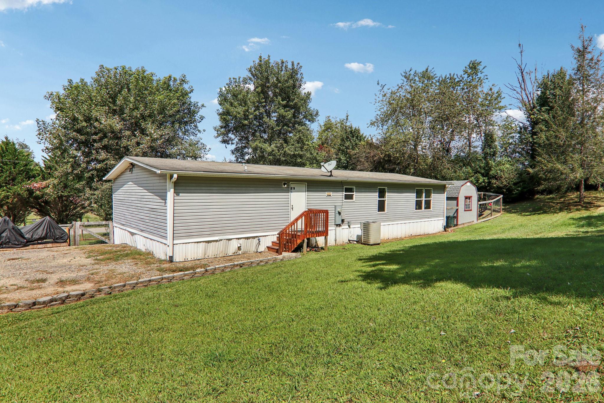 4 Sweet Birch Drive Alexander, NC 28701 - Photo 46 of 48 a view of a house with backyard and garden