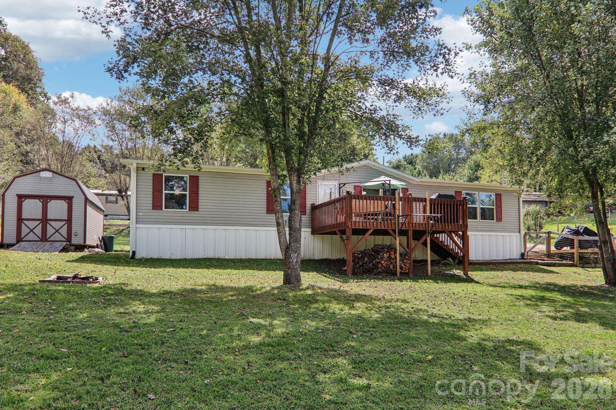 4 Sweet Birch Drive Alexander, NC 28701 - Photo 6 of 48 a view of a house with backyard and a tree