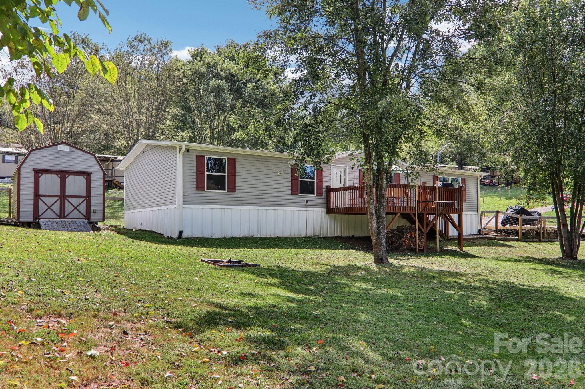 4 Sweet Birch Drive Alexander, NC 28701 - Photo 8 of 48 a view of a backyard with a garden and plants
