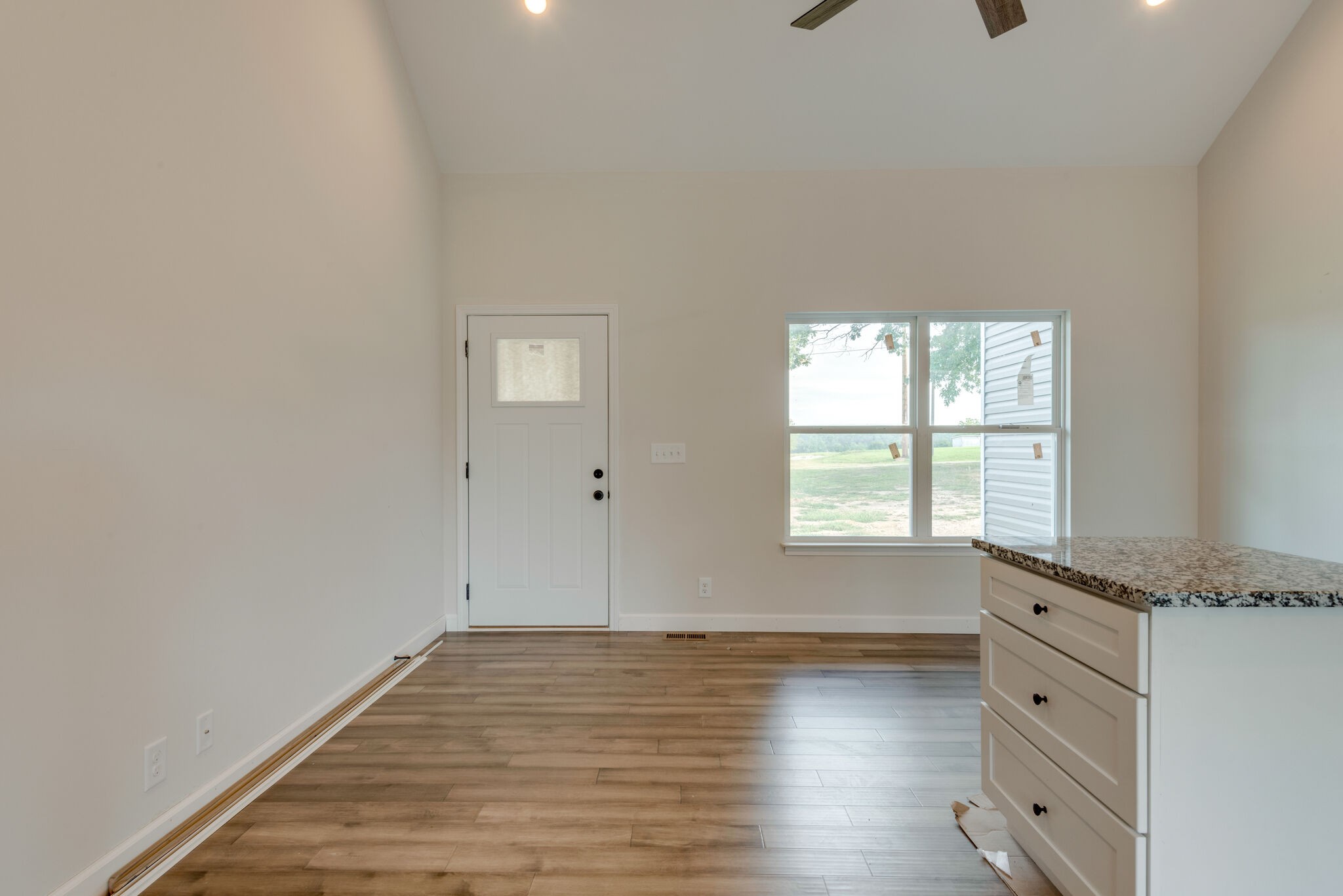 1172 Oak Grove Road Dickson, TN 37055 - Photo 4 of 29 wooden floor in an empty room with a window