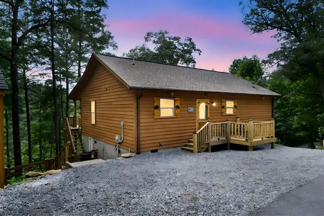 a view of a house with a backyard