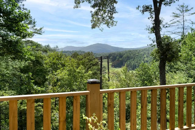 a view of a chair and table under an umbrella