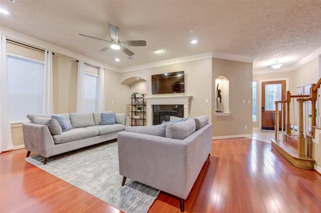 a living room with furniture and a fireplace