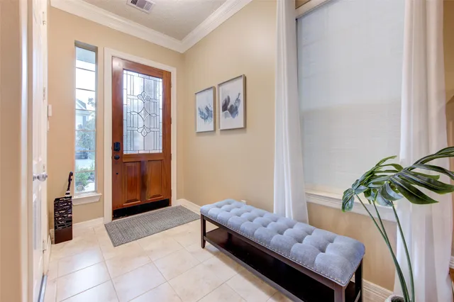 a room with furniture and a potted plant