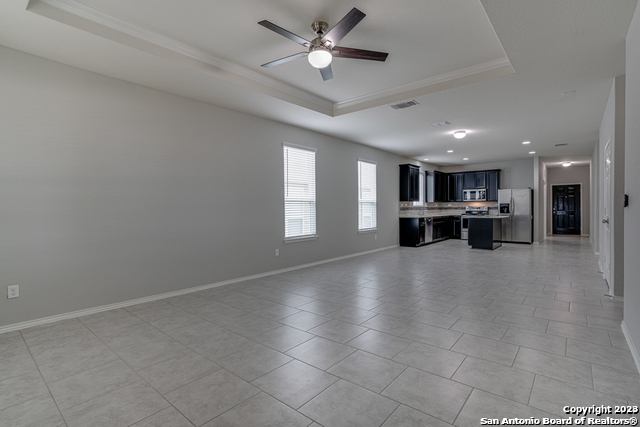 27319 Sterling Silver San Antonio, TX 78260 - Photo 14 of 28 a view of an empty room with a window and a kitchen