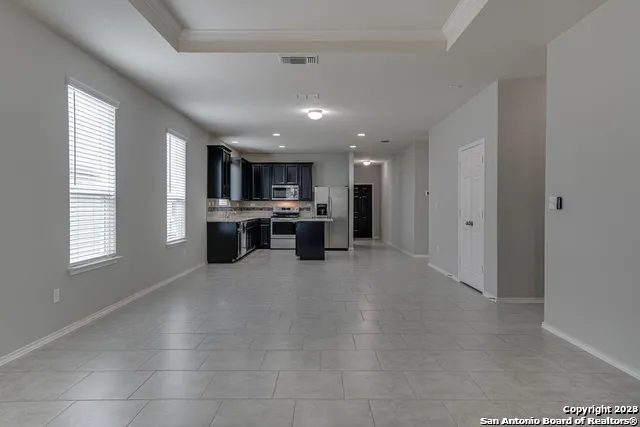 a view of a kitchen with a sink cabinets and a window