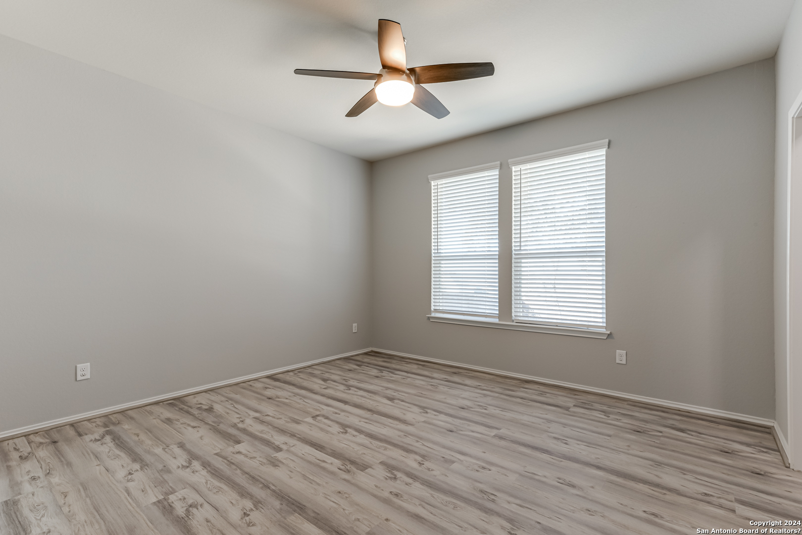 27319 Sterling Silver San Antonio, TX 78260 - Photo 17 of 28 wooden floor in an empty room with a window
